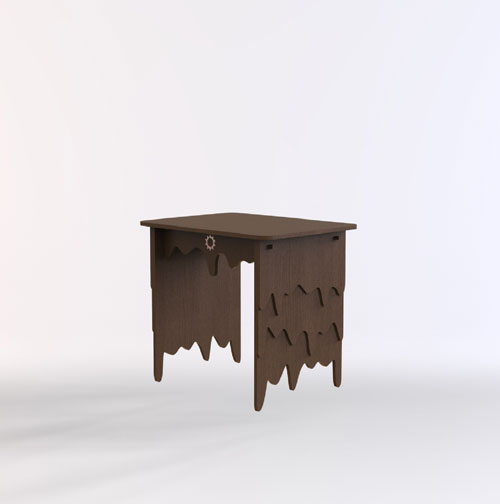 Small brown wooden desk with irregular scalloped sides and a gear-shaped accent on the front edge.