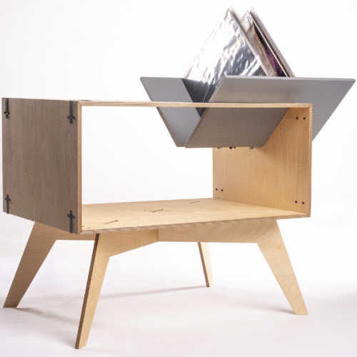 Wooden mid-century storage bench with an open shelf and a metal magazine rack on top holding magazines