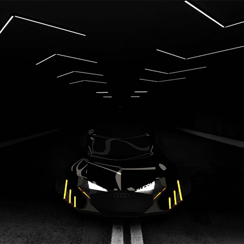 Dark futuristic sports car with glowing yellow accents driving through a dimly lit tunnel lined with angled white light bars.