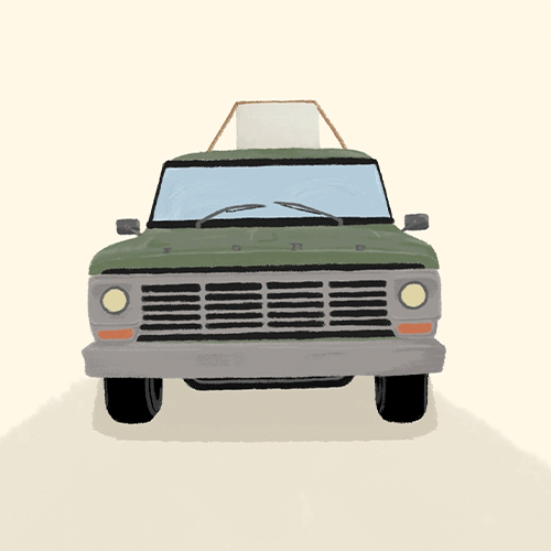 Front view of a green vintage pickup truck facing the viewer on a pale background.