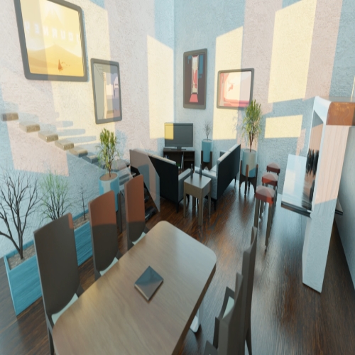 Modern lounge/cafe interior with a long wooden table, high chairs, and a seating area with couches by a wall-mounted computer desk. Artwork on the walls and stairs to a lower level on the left.