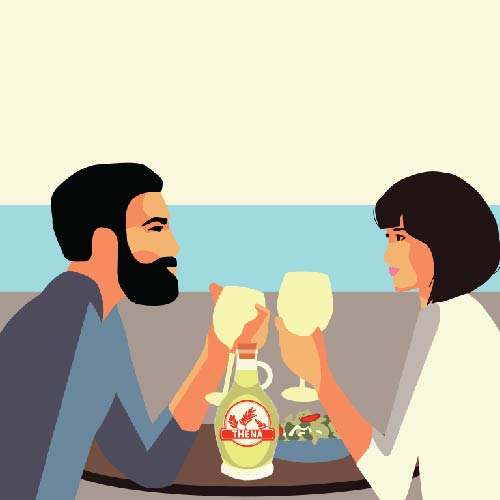 Couple toasting with wine glasses at a seaside cafe.